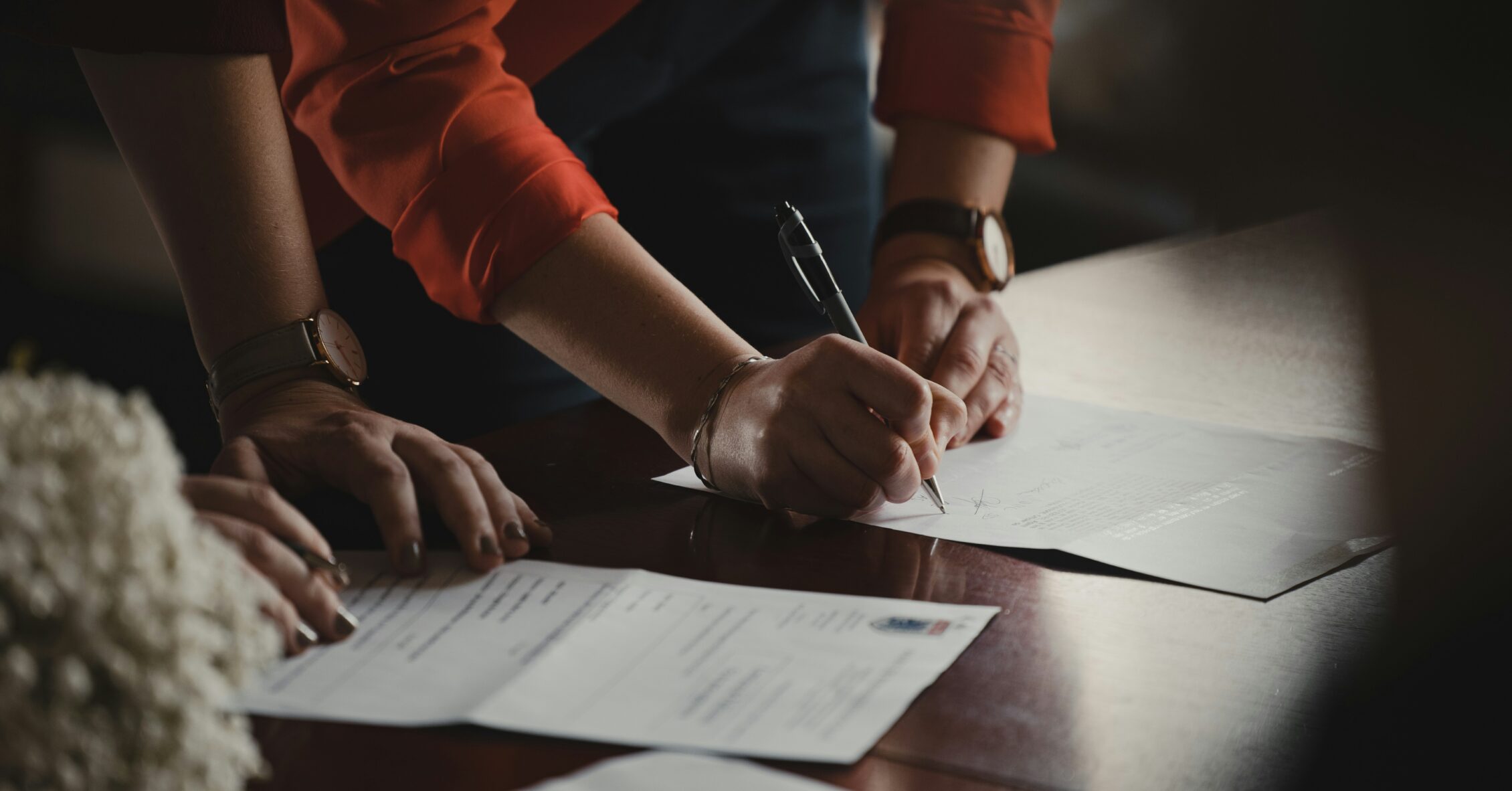 Buyer and seller signing a real estate contract