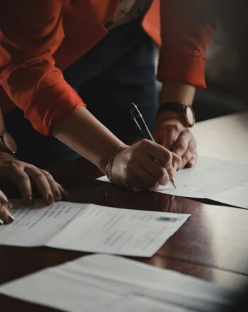 Buyer and seller signing a real estate contract