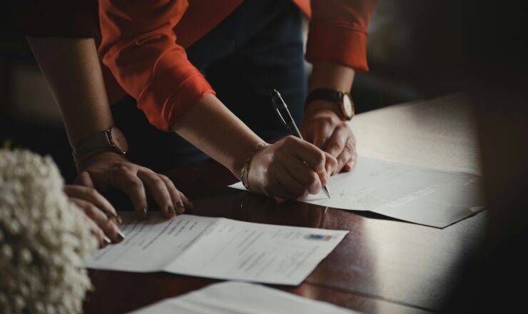 Buyer and seller signing a real estate contract